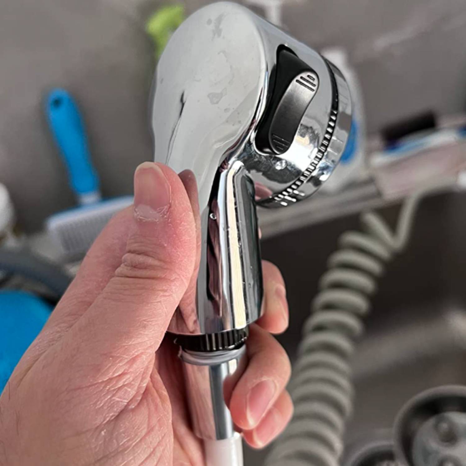 Sink sprayer attachment fitted to a utility sink tap